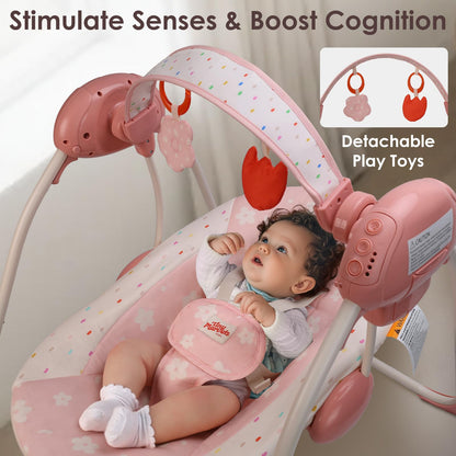 Aura Restored Tiny Marvels infant swing in blush bloom with removable toy bar, adjustable speed, music, foldable design for 0-9 months.